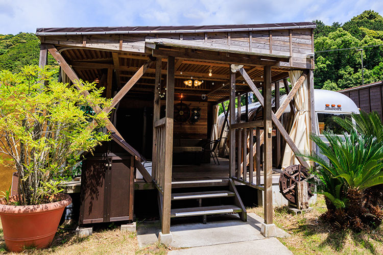 Entrance of a wooden resort reception building.